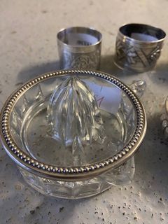 null Silver lot including a citrus press, a wine taster, an egg cup and 3 napkin...