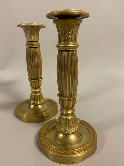 null 
Pair of metal candleholders, decorated with rosettes and grooves. A pair of...