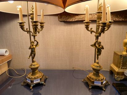 null Pair of four-light gilt bronze candelabra with cherubs decoration 

Empire Style

...