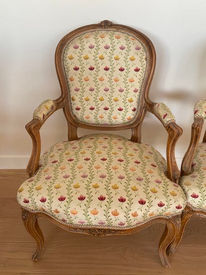 null Pair of Louis XV style armchairs in natural wood with flower decoration trim...