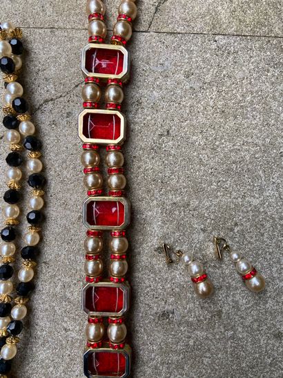 null Two necklace sets - earrings, red stones and black stones

(sold as is)