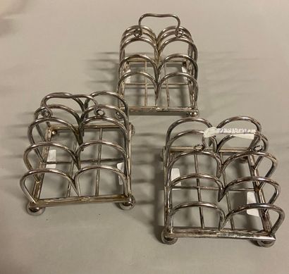 null 
Set in silver plated metal including a suite of 3 toast holders, CHRISTOFLE....