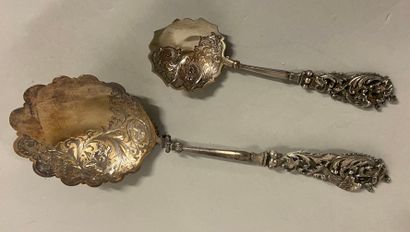 null 
Serving spoon and small silver spoon, chiselled decoration of wolf and dragon...