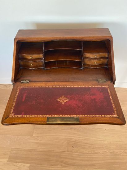 null Wood and wood veneer sloping desk with two drawers opening on the sides, resting...