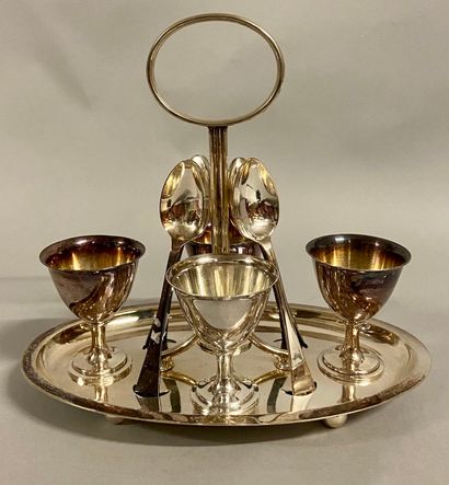 null 
Suite of 4 egg cups and 4 spoons and their display in silvery metal. 




Signed...