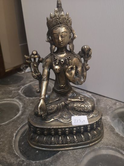 null Lot including: a bronze Buddha head, a bronze Buddha in lotus position and a...
