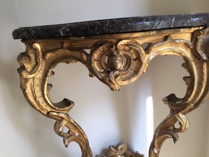 null Gilded wood console with rocaille decoration of shells and scrolls _x000D_.

Louis...