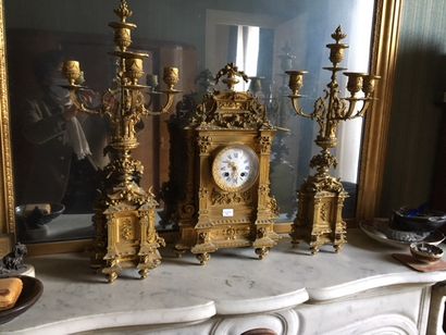 null Gilded bronze mantelpiece: clock and two candelabras_x000D_.

End of the 19th...