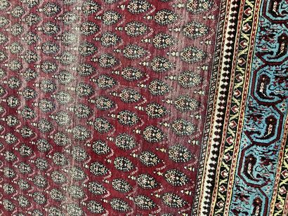 null Persian carpet red background with boteh decoration

wear and tear lot sold...