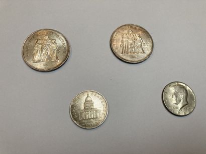 null Set of two 50 franc coins, one 100 franc coin and one half dollar coin.

Lot...