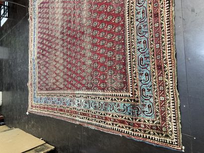 null Persian carpet red background with boteh decoration

wear and tear lot sold...