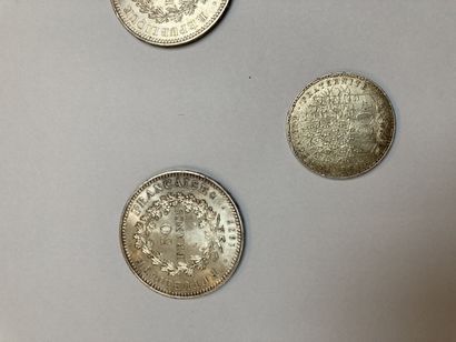 null Set of two 50 franc coins, one 100 franc coin and one half dollar coin.

Lot...