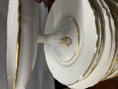 null Large batch of white and gold porcelain, some monogrammed SD, including soup...