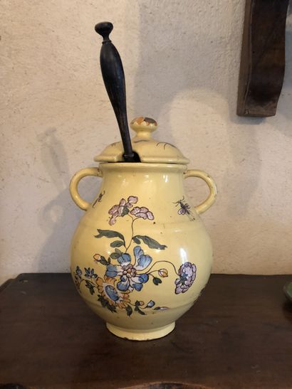null Vinegar jar with floral decoration, yellow backgroundCirca 1800