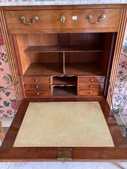 null 
SECRETARY

In mahogany and mahogany veneer, opening with four drawers

and...