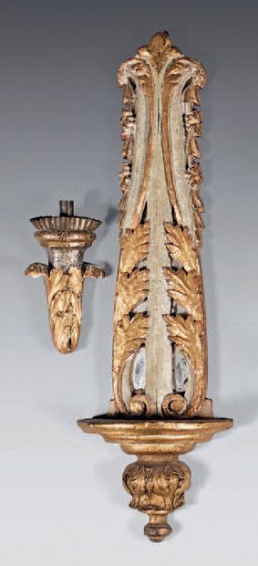 A carved, gilded and rechambered wood sconce...