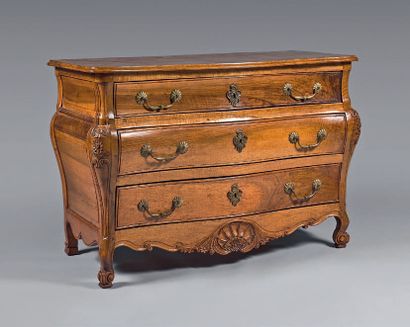  A moulded and carved walnut chest of drawers,...