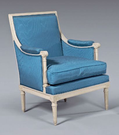  Flat back moulded, carved and cream lacquered beech armchair; the arm brackets are...