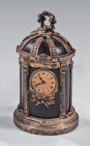 null Meeting of two chased silver clocks with gilt mountings in the form of temples...