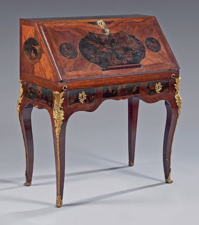  A sloping desk with amaranth quartefeuille inlaid in frames of amaranth wire and...