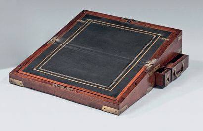 null Mahogany writing case; rectangular in shape, it unfolds into a desk covered...