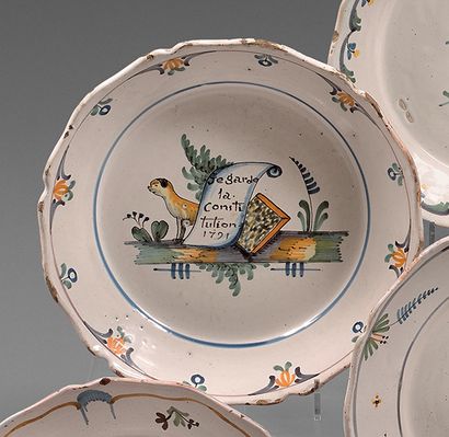 NEVERS Earthenware plate with contoured edge, with polychrome decoration of a dog...