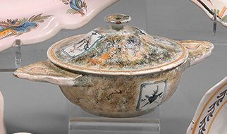 NEVERS An earthenware covered wedding bowl with contoured rim, with polychrome decoration...