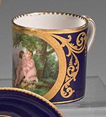 SÈVRES 
Two cups litrons on blue bottom decorated in a gilded medallion for the one...