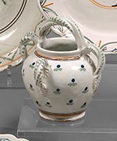 NEVERS Earthenware jug with four twisted handles and a spout, with polychrome decoration...