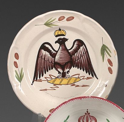 null Two French earthenware plates from the beginning of the 19th century.
With polychrome...