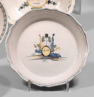 NEVERS Earthenware plate with a contoured border, with polychrome decoration of a...