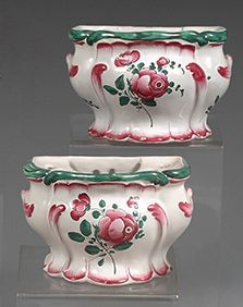 LUNEVILLE Pair of wall-mounted earthenware flowerpicks with floral decoration.
Late...