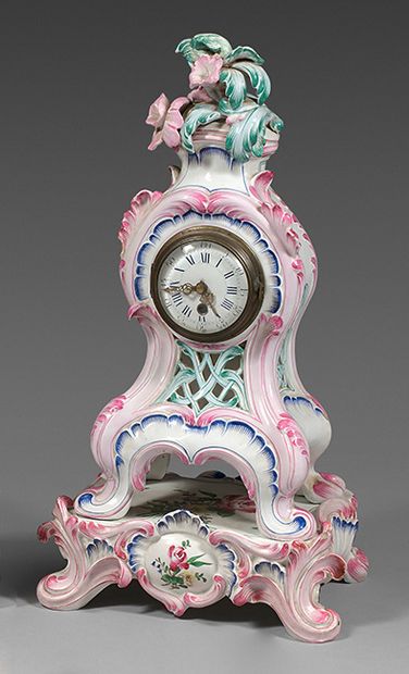 SAINT-CLÉMENT Openwork earthenware clock in the Rocaille style and its tray, with...