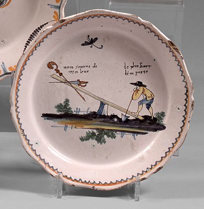 NEVERS Earthenware plate with contoured border, with polychrome decoration of a peasant...