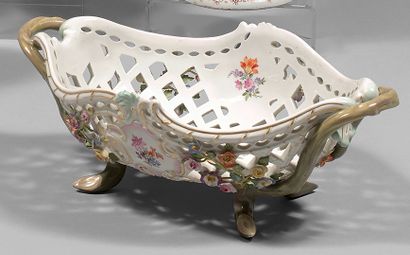 MEISSEN An oval openwork porcelain basket with two rocaille handles, ending with...