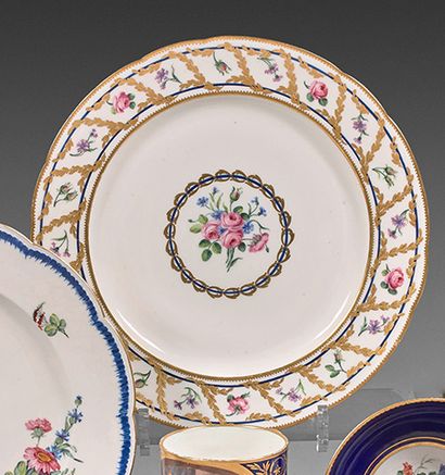 SÈVRES A soft porcelain plate, from the Tourton and Ravel bankers' service, decorated...