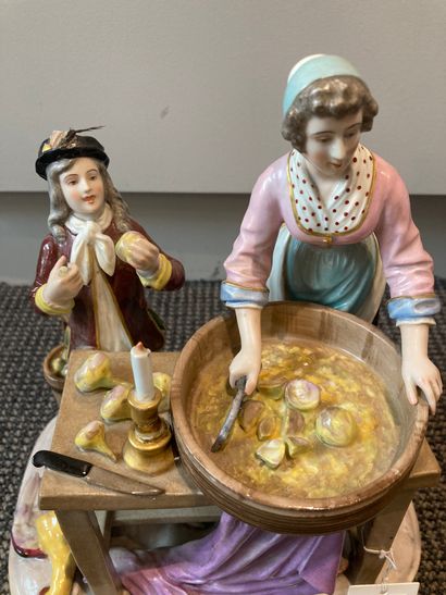 PARIS Porcelain group treated in polychromy showing a young woman chopping onions...