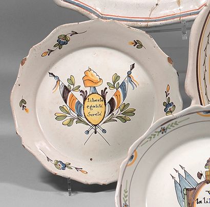 NEVERS Earthenware plate with contoured border, with polychrome decoration of a central...