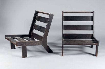 TRAVAIL FRANÇAIS 1940 Pair of low armchairs in black ceruse oak. Straight legs at...