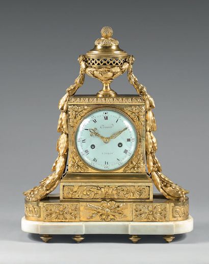 null A chased and gilt bronze clock; the cover supporting a potpourri holding large...