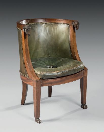 null A mahogany and mahogany veneer desk armchair ; the backrest with ram's head...