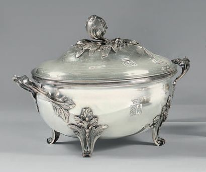 null A Louis XV style silver tureen, its covered lining and cover, oval on four feet...