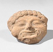 null Tête de méduse d'applique.
Terre cuite rose.
Grande Grèce, IVe siècle av. J-C.
H :...