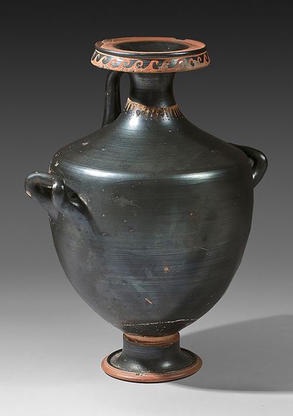  Black-glazed hydria decorated with meanders on the lip and a tassel necklace on...