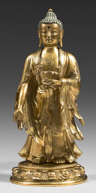 TRAVAIL SINO-TIBETAIN Statuette en bronze doré et traces de polychromie, de bouddha...