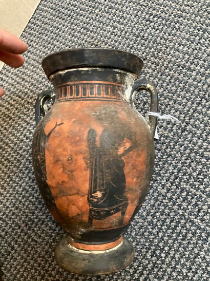 null Small black-figured amphora decorated on one side with three naked ephebes and...