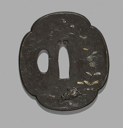 Iron tsuba decorated with a grasshopper and...