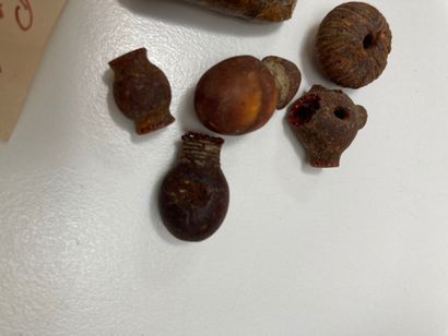 null Lot of beads and a pendant in the shape of a stylized zoo-morph head.
Cracked...