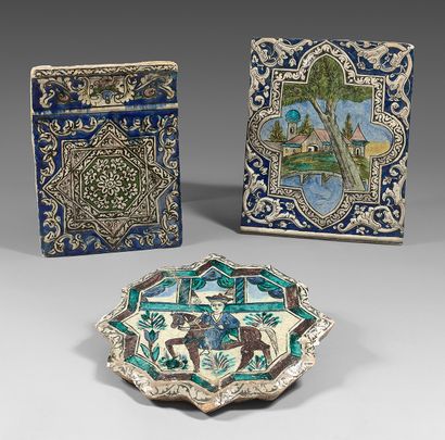 IRAN QADJAR Three large silica-glazed ceramic tiles painted in polychrome with various...