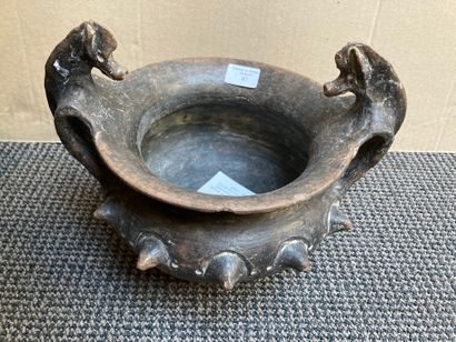 null A cantharoid bowl with two handles topped by horses' heads. The shoulder is...
